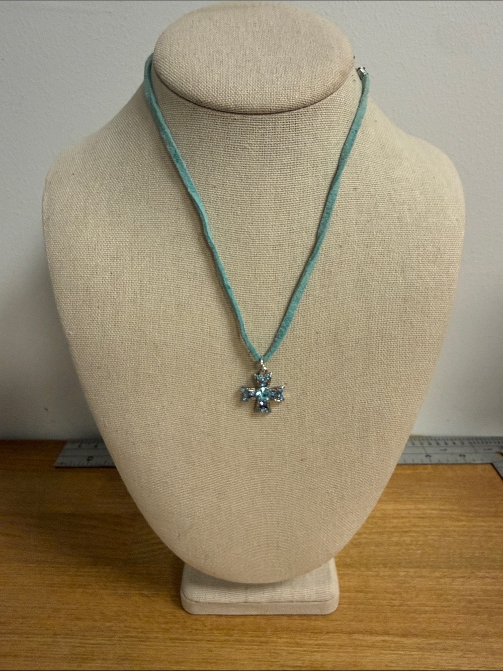 Light blue crystal Greek cross on leather cord chain
